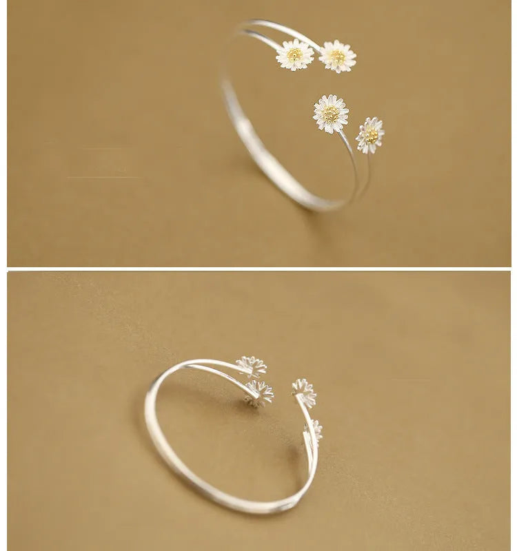 S925 sterling silver double daisy bracelet on a plain background, showing two daisy-shaped elements in a layered design