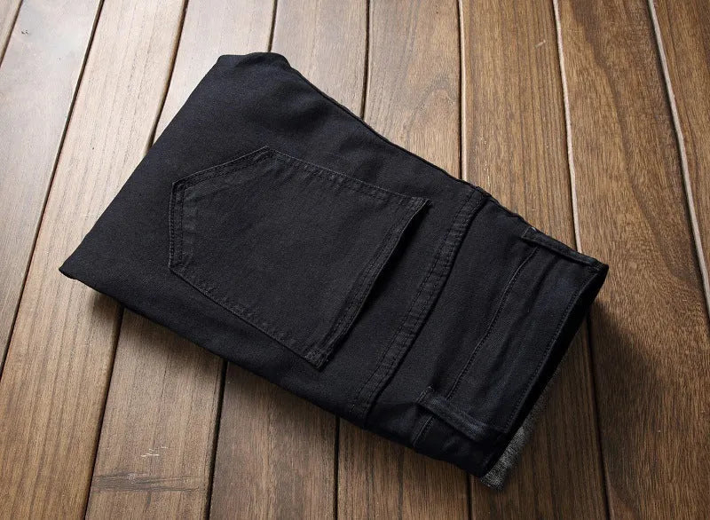 Pair of men's black basic straight jeans with worn finish, 98% cotton, side view