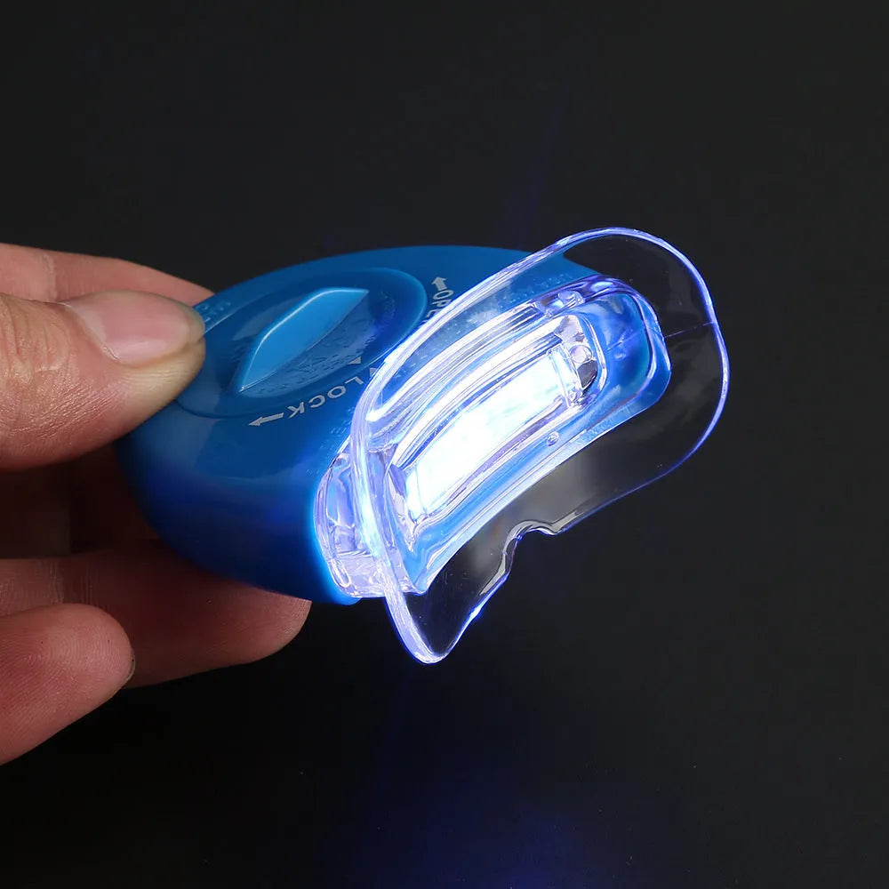LED teeth whitening kit with button switch and denture tray in blue
