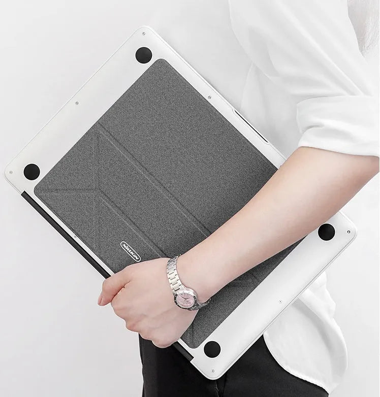 Blue foldable laptop cooling bracket with anti-slip surface shown open next to a closed laptop