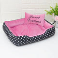 Polka dot printed small dog bed with matching square pillow in grey, blue, pink, or red.