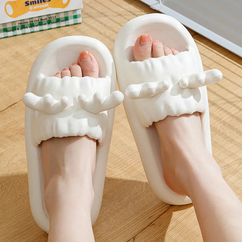 Women's deer horn pattern EVA flip-flop slippers in light yellow, showing hollow-out design and textured sole.