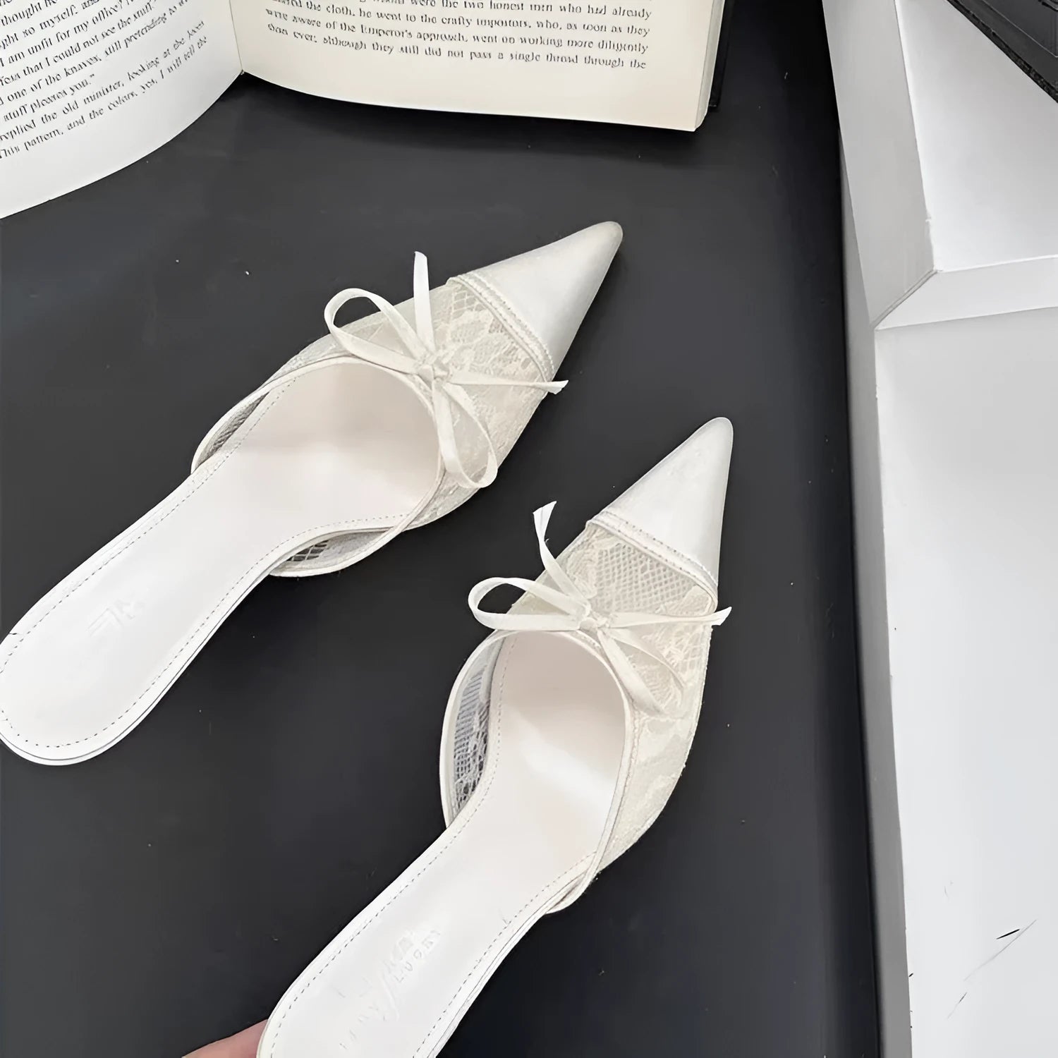 Women's light brown lace bowknot pointed toe high heels with mesh upper on a neutral background