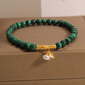 White crystal lucky bamboo bracelet with adjustable closure on a wrist.