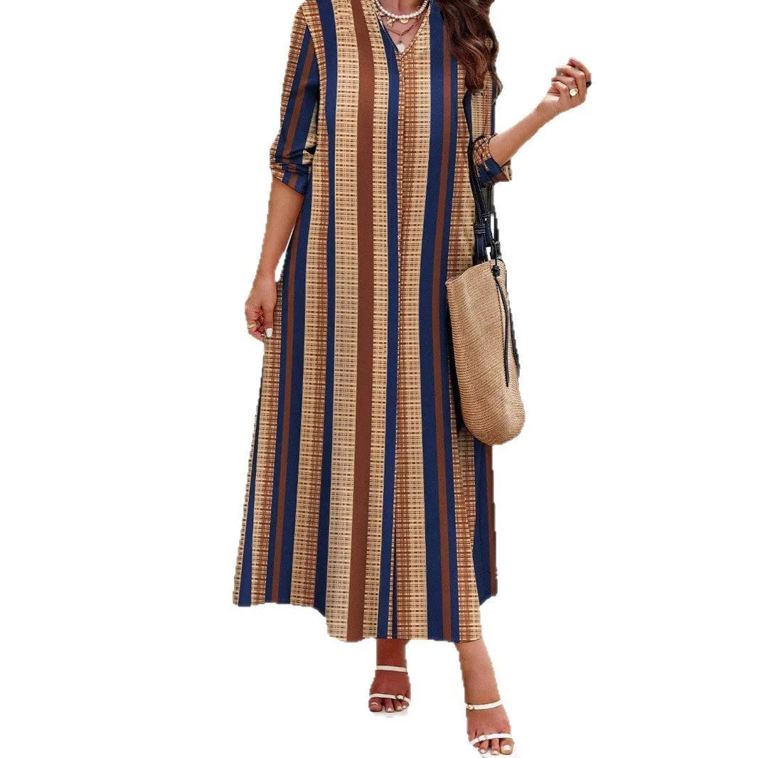 Camel coloured women's dress with vertical stripes, V-neckline, and A-line skirt