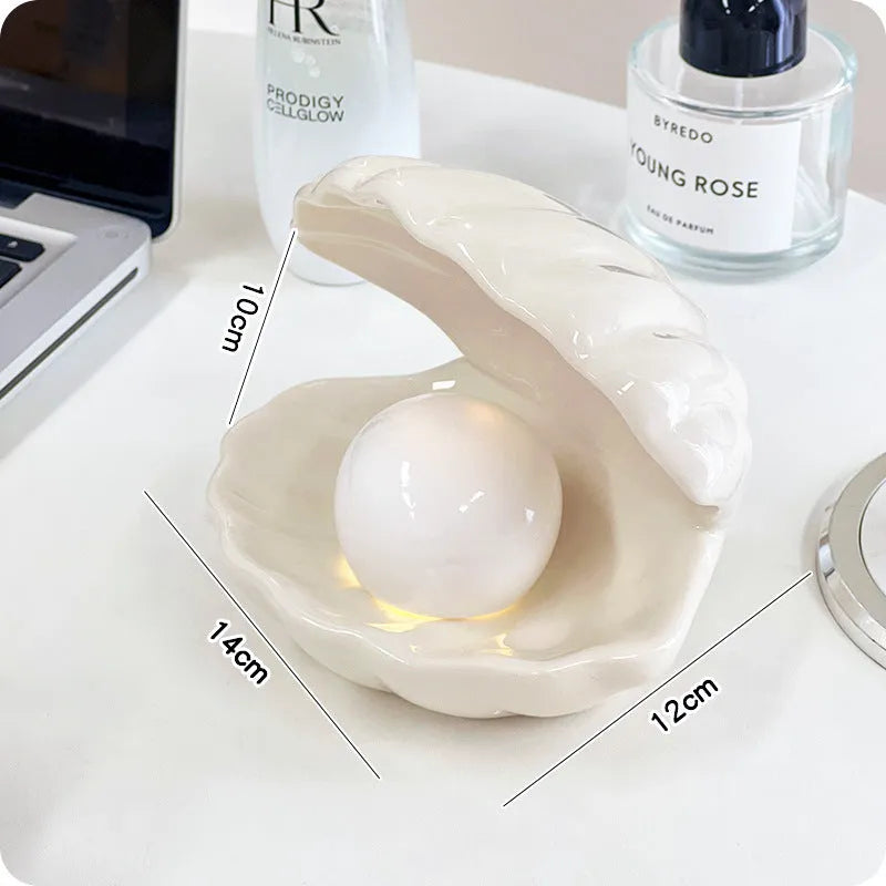 White porcelain night lamp with storage tray in modern design, available with pink or white shell options