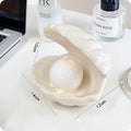 White porcelain night lamp with storage tray in modern design, available with pink or white shell options
