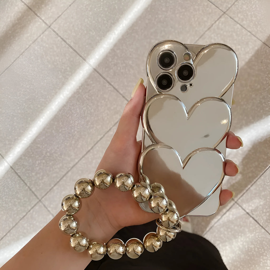 iPhone case with a 3D electroplated red love heart on a solid colour TPU soft shell.
