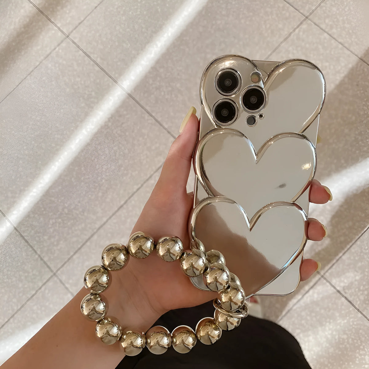 iPhone case with a 3D electroplated red love heart on a solid colour TPU soft shell.