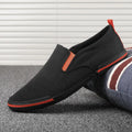 Men's low-top casual canvas shoes in grey, black orange, or khaki with vulcanised rubber soles.