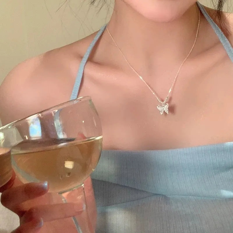 Women's square line opal butterfly necklace on a silver cross chain, adjustable from 41cm to 50cm.