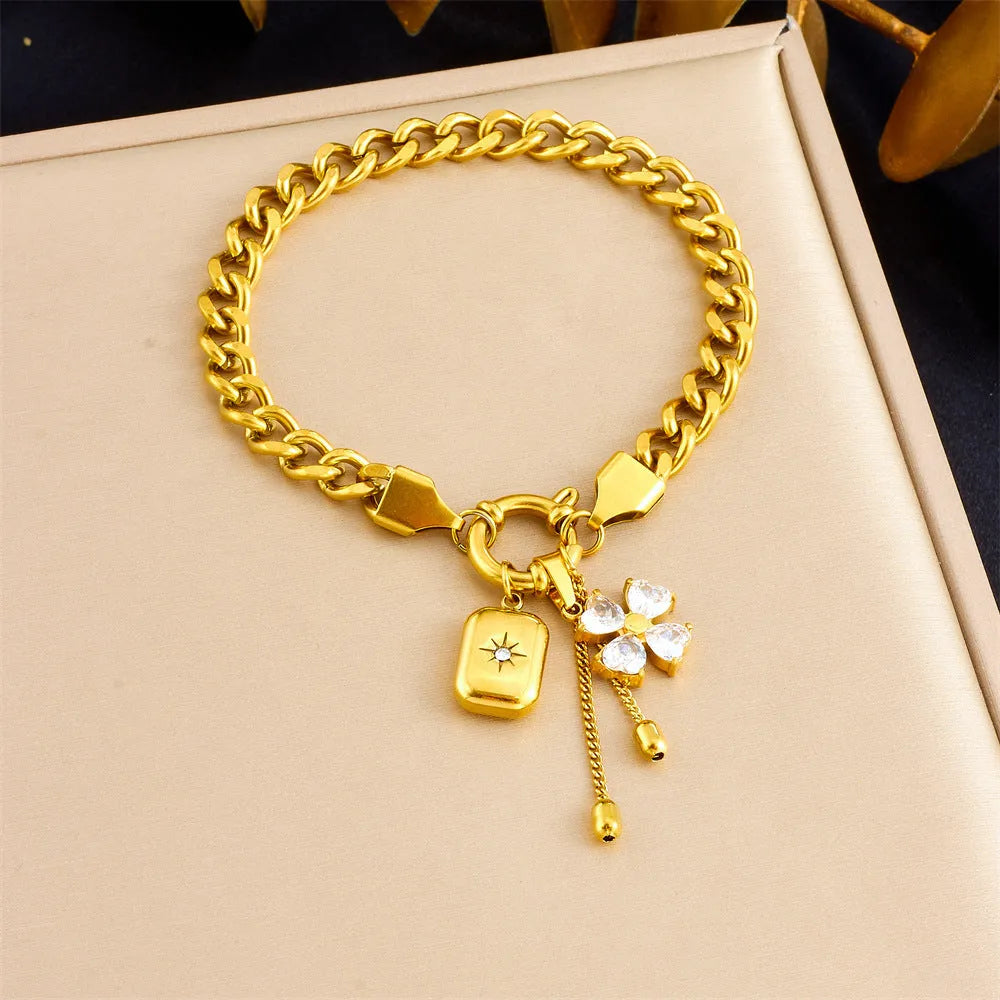 Tassel stainless steel bracelet and necklace set with flower and butterfly motifs for women
