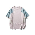 Men's loose blue short sleeve t-shirt with raglan sleeves on a hanger.