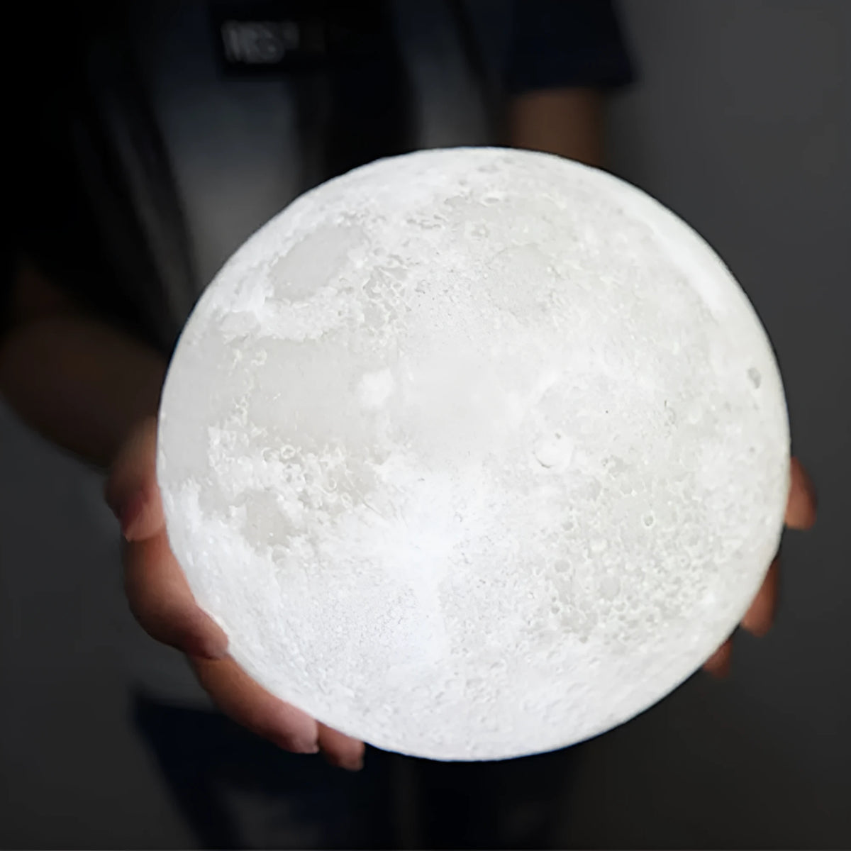 3D printed moon lamp showing detailed craters, with a touch metal ring at base for colour changing and dimming control.