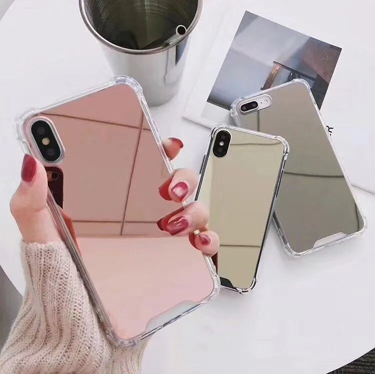 Mirror finish iPhone case with reflective surface showing TPU flexible construction and precise port cutouts