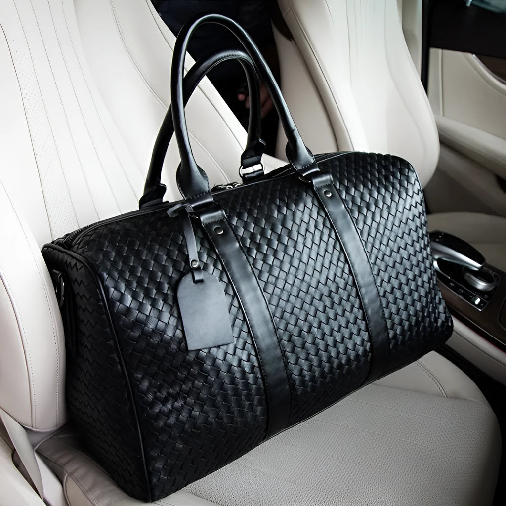 Black medium PU leather shoulder bag with woven texture and zipper closure for travel and business use