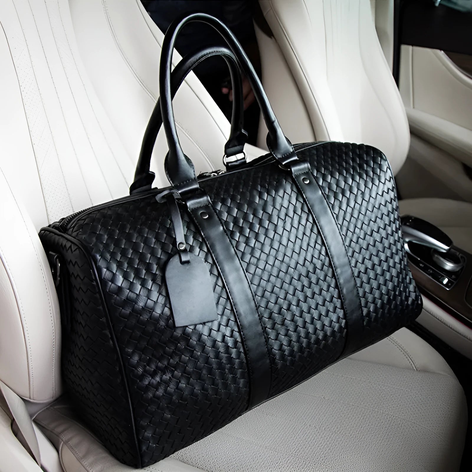 Black medium PU leather shoulder bag with woven texture and zipper closure for travel and business use