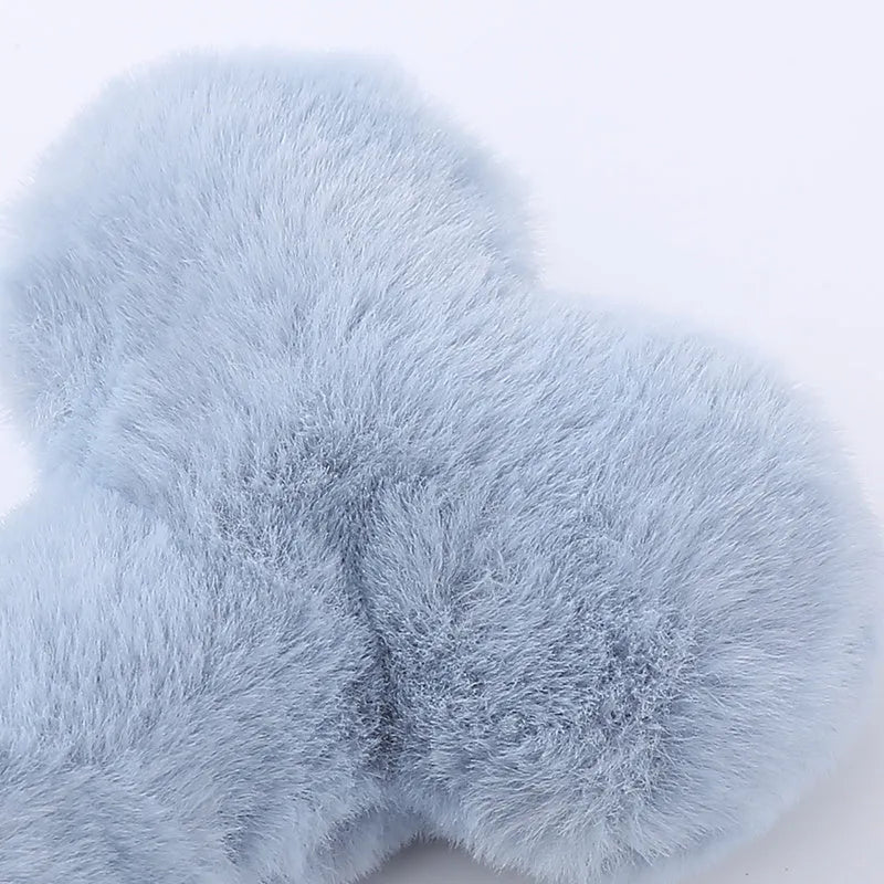 Blue bone-shaped plush dog toy with squeaker for interactive play and chewing.