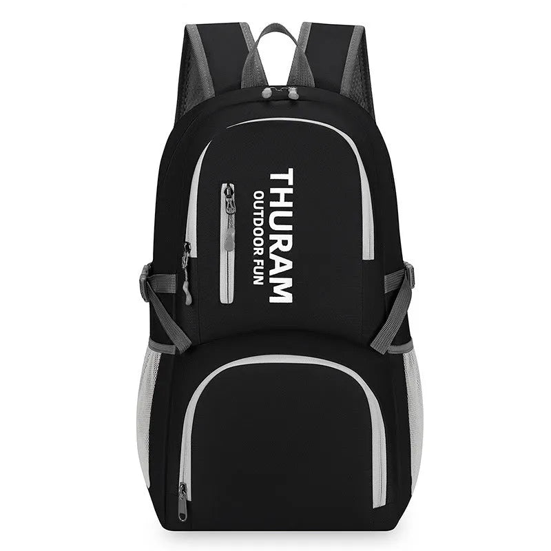 Outdoor folding rucksack in dark blue with air pillow belt system showing 20-35 litre capacity