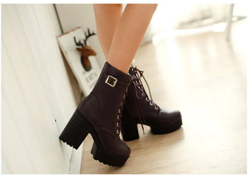 Women's short PU martin boots with thick high heel in black, side view showing lace-up front and ankle-high tube