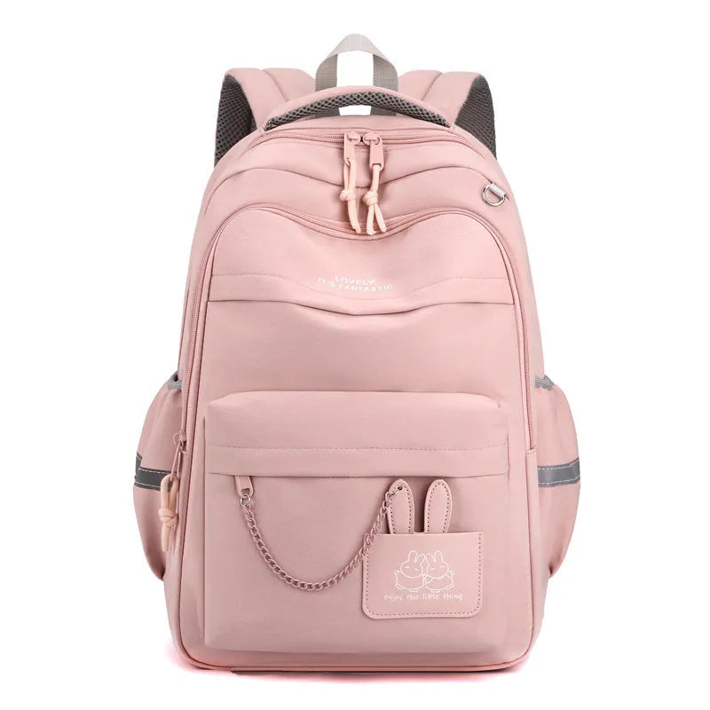 Nylon school backpack 30x21x43cm with letter pattern, available in pink, black, orange, and purple.