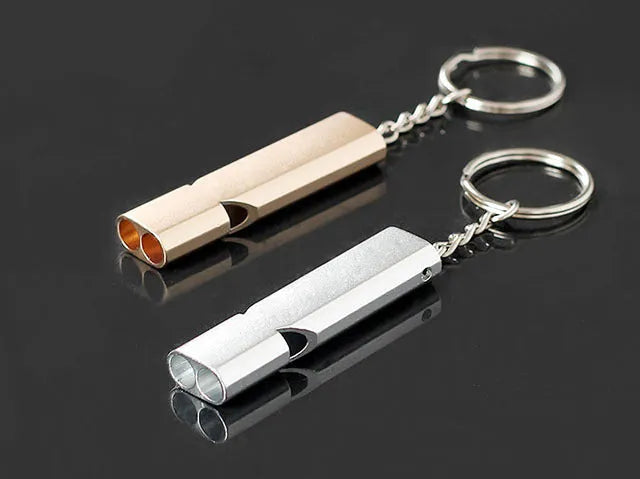 Silver and gold aluminium alloy double hole outdoor survival whistle.