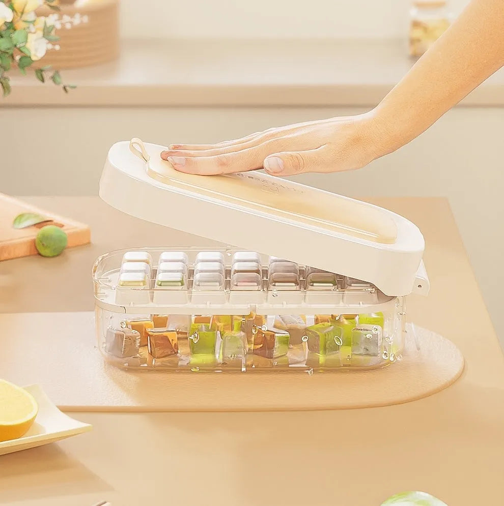 Food-grade plastic ice cube tray with grid, ice shovel, and storage compartment in blue colour.