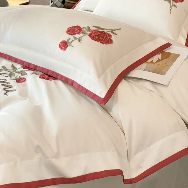 Cotton four-piece bedding set in solid colour with embroidery, includes quilt cover, bed sheet, and pillowcases