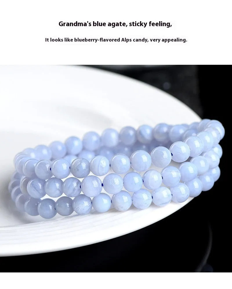 Blue agate bracelet with scattered striped beads and traditional ruyi design elements