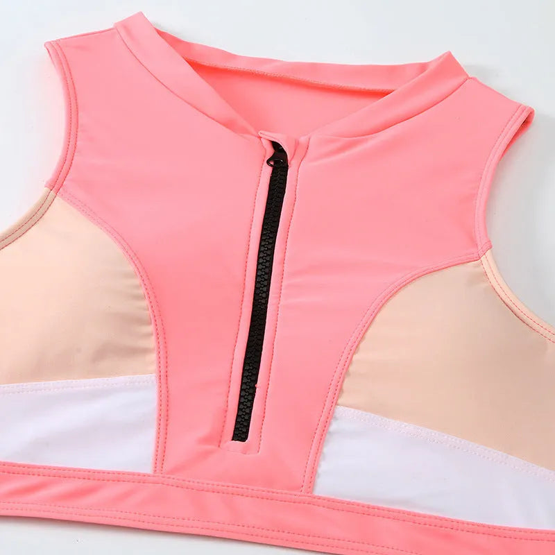 Pink high waist split bikini swimsuit set with bra top and shorts on a mannequin
