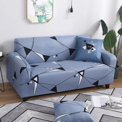 Geometric patterned stretch sofa slipcover on a modern three-seater sofa.