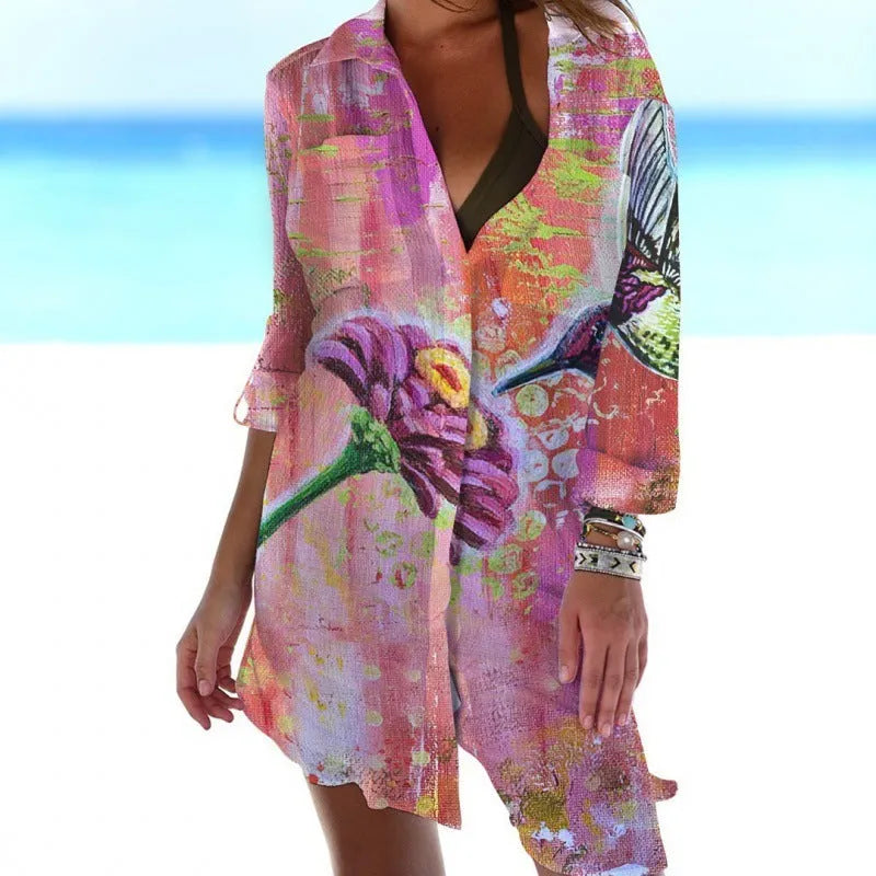 Women's long sleeve cardigan with 3D printed bird and flower painting pattern, on a hanger.