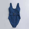 Navy blue women's one-piece swimsuit with triangular chest shape and integrated chest pads
