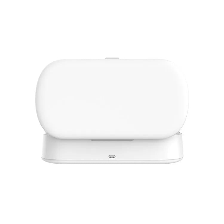 White ABS plastic wireless UV steriliser box with phone inside, showing charging indicator.