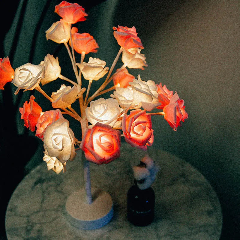 Rose flower LED table lamp with warm white glow on a flat surface, showing PE cotton flowers and bonsai tree shape