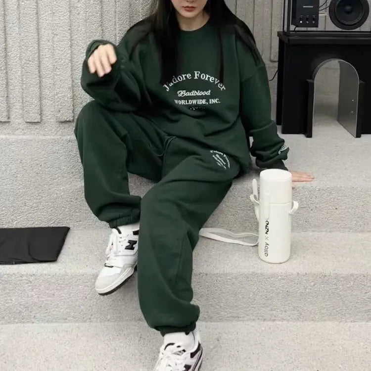 Women's cotton green American-style long-sleeved casual sportswear suit with trousers on a model