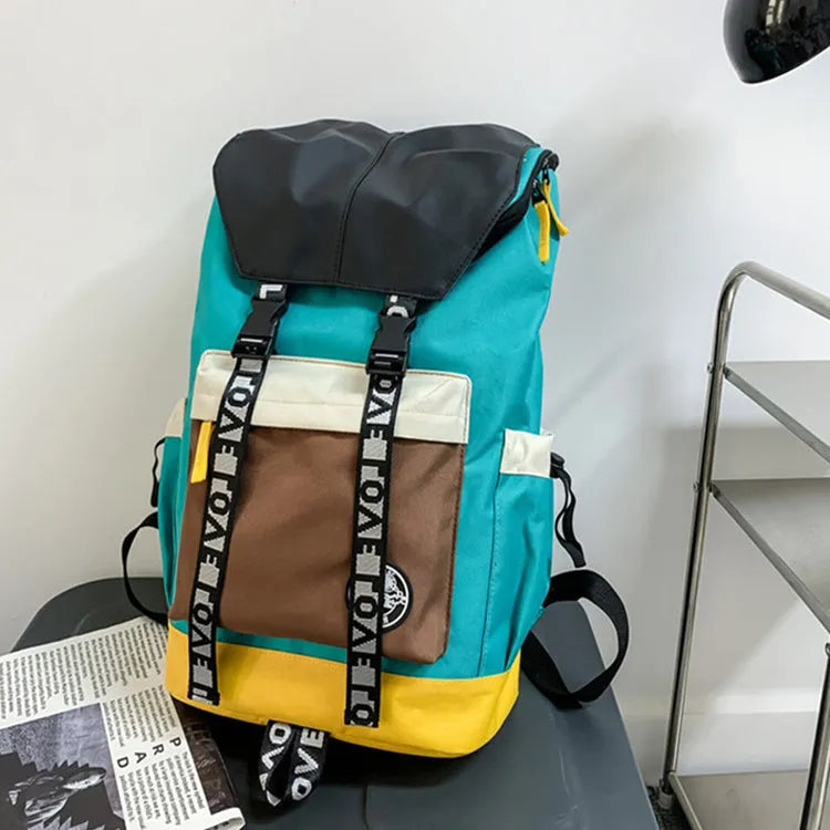 Oxford cloth backpack in black, green, or red with shoulder straps and handle