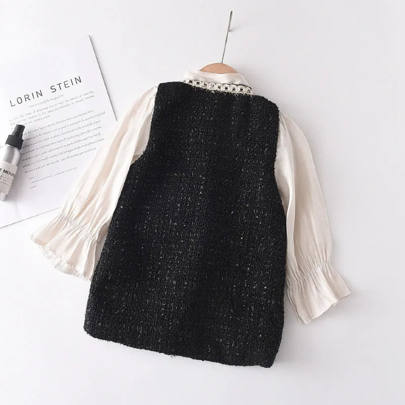Children's black princess dress with long sleeves and stitching design on polyester fabric