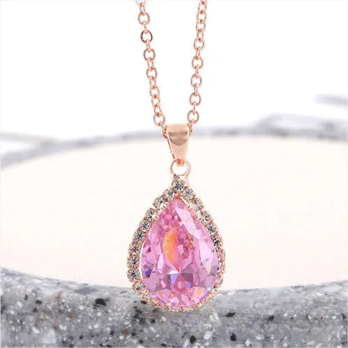 Rose gold water drop necklace with geometric rhinestones in pink colour