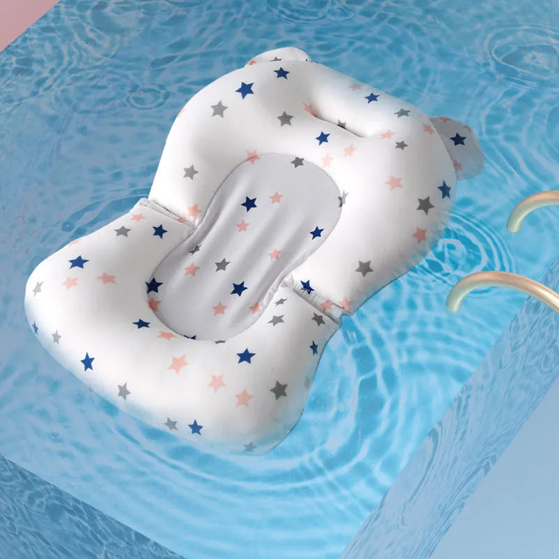 Foldable baby bath support mat with styrofoam fill in white star pattern on a baby bathtub