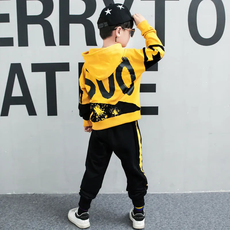 Boys yellow cotton hooded sports suit two-piece set with long sleeves and trousers.
