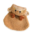 Green granular velvet Christmas pet cape with tree-shaped hat and star on a small dog