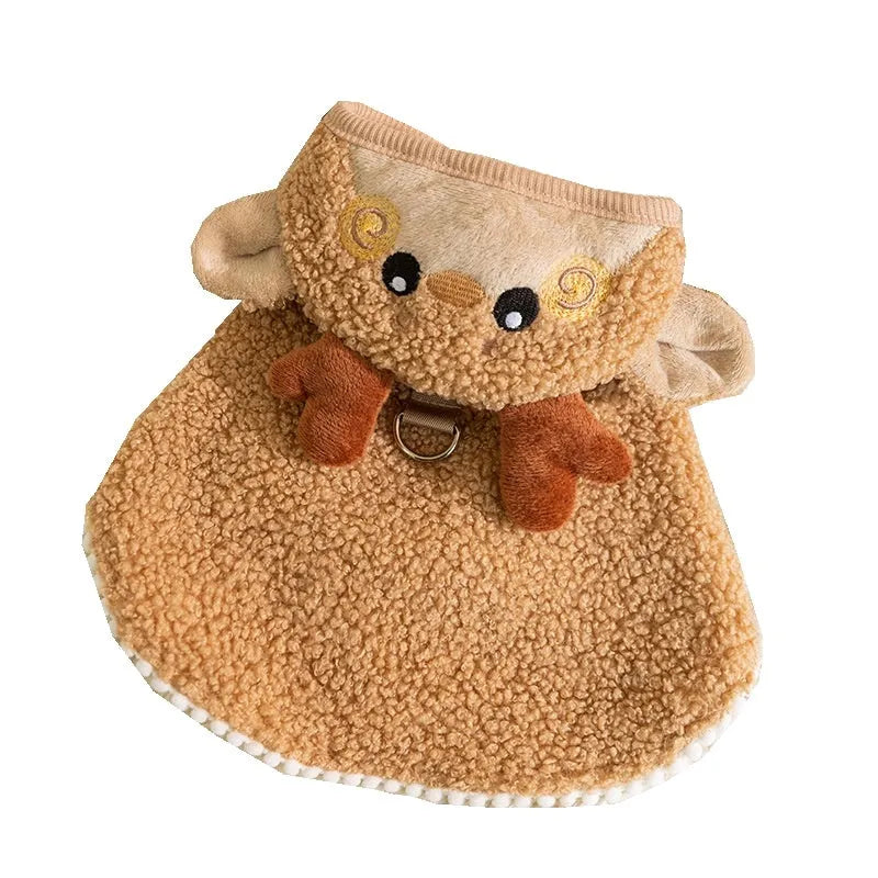 Green granular velvet Christmas pet cape with tree-shaped hat and star on a small dog