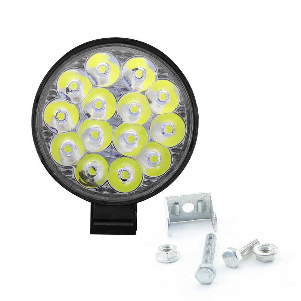 Round white LED work light with aluminium housing for vehicle mounting