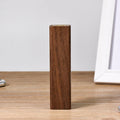 Portable power bank with brown walnut wood shell showing charging ports