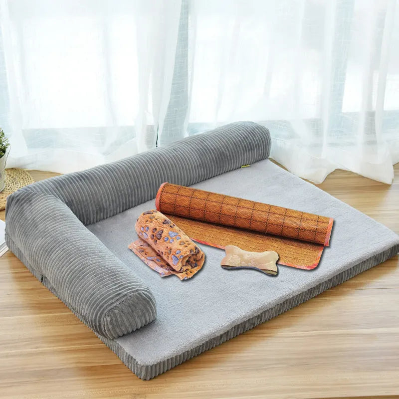Corduroy pet sofa dog bed in grey with raised sides on a wooden floor