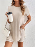 Women's casual cotton shorts suit in black, featuring a crew neck top with half sleeves and matching ribbed shorts.