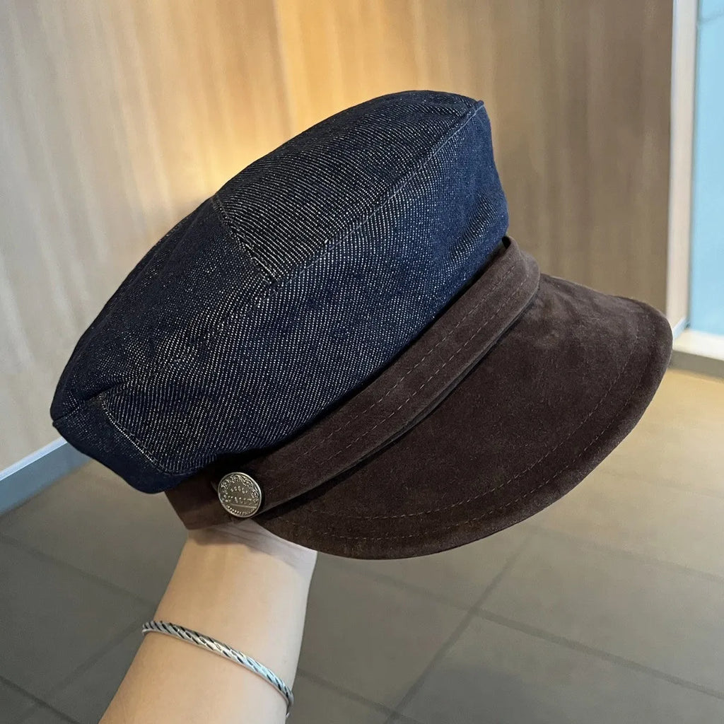 Dark blue denim adjustable octagonal newsboy cap shown on a neutral background.