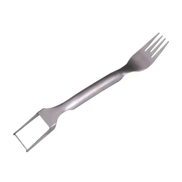 Silver stainless steel watermelon slicer and serving fork on a kitchen counter