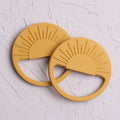 Silicone baby teether toy in multiple colours including pink and yellow, 88x88mm for infant teething relief